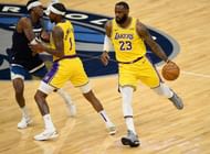 Kentavious Caldwell-Pope #1 of the Los Angeles Lakers sets a pick for Jarred Vanderbilt #8 of the Minnesota Timberwolves as teammate LeBron James #23 dribbles past.